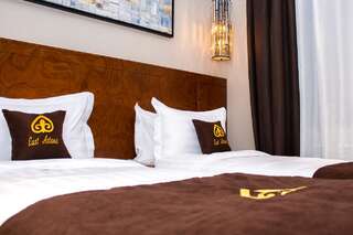Отель East Astana Hotel Нур-Султан Улучшенный двухместный номер с 2 отдельными кроватями-7
