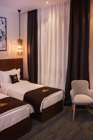 Отель East Astana Hotel Нур-Султан Улучшенный двухместный номер с 2 отдельными кроватями-8